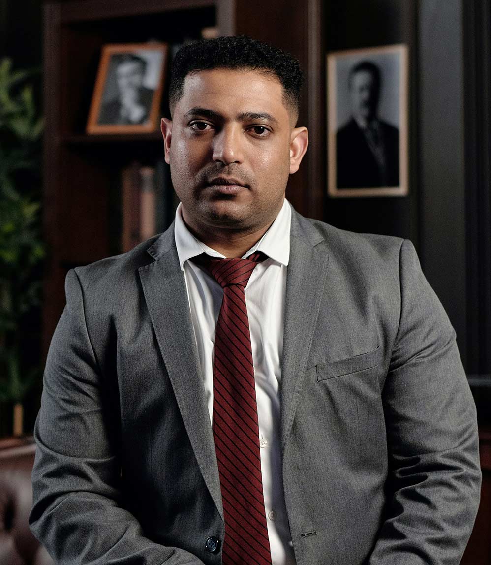 professional-firms-accountant man in suit and tie with a serious look on his face staring into the camera